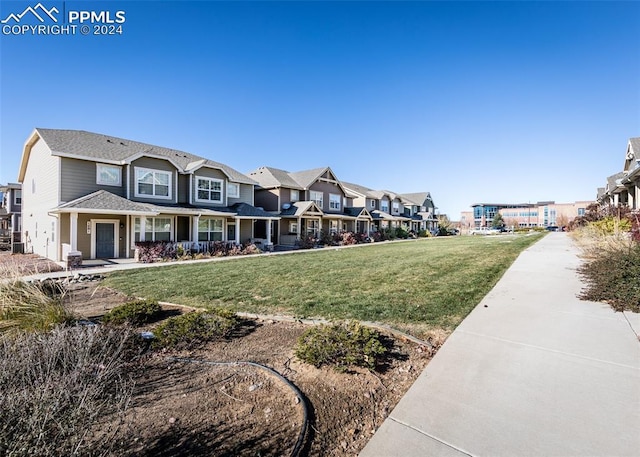 1441 Kempton Aly, Colorado Springs, CO 80910 - surrounding community with a residential view and a yard