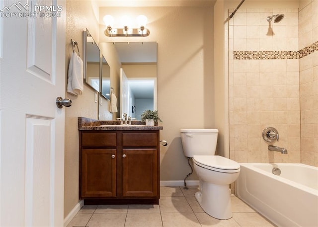1441 Kempton Aly, Colorado Springs, CO 80910 - full bathroom with tile patterned flooring, vanity, toilet, tub / shower combination, and baseboards