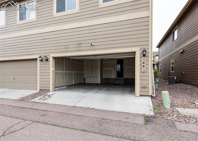 1441 Kempton Aly, Colorado Springs, CO 80910 - garage featuring cooling unit