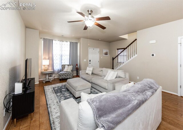 1441 Kempton Aly, Colorado Springs, CO 80910 - living area with a ceiling fan, stairs, and wood finished floors