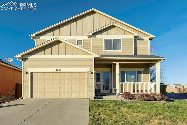 craftsman-style house featuring a garage and covered porch