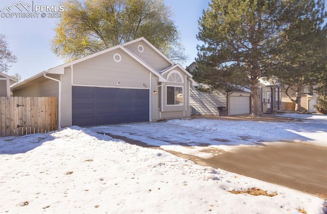 view of snow covered garage