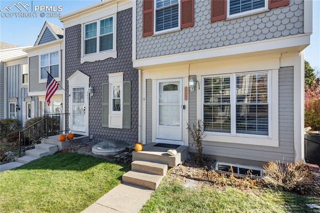 view of property featuring a front yard