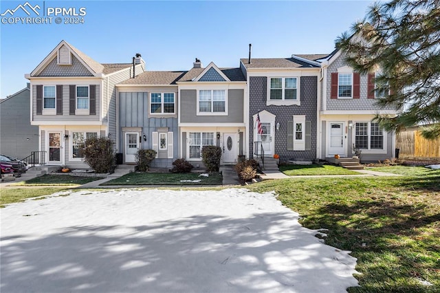 view of property with a front lawn