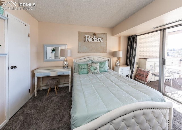 bedroom with access to outside, dark carpet, and a textured ceiling