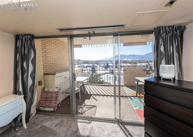 carpeted bedroom featuring a mountain view