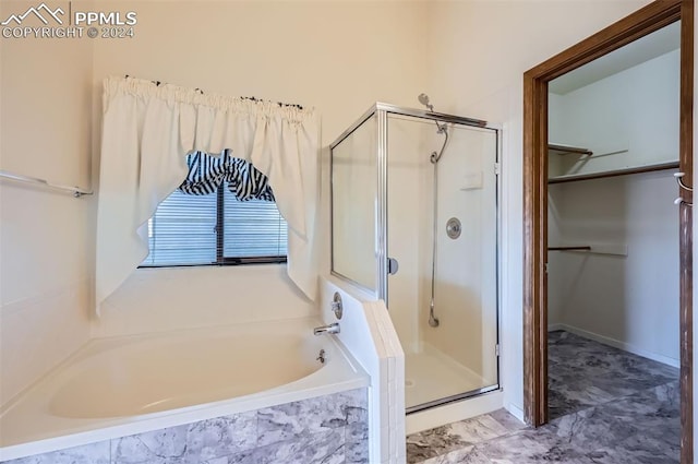 bathroom with separate shower and tub