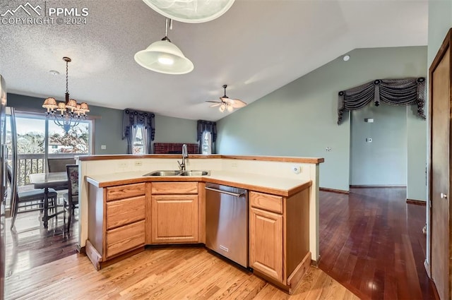 kitchen featuring dishwasher, light hardwood / wood-style floors, lofted ceiling, and sink