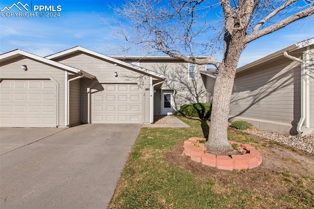 ranch-style home featuring a garage