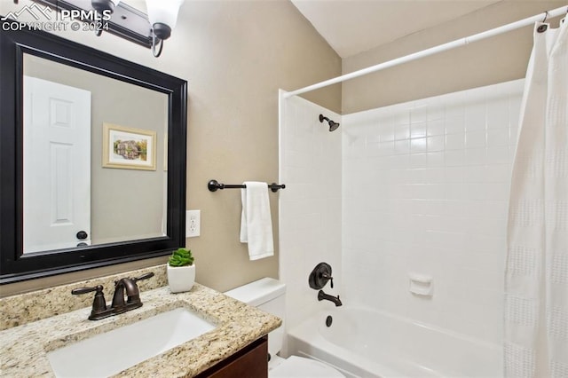 full bathroom with shower / tub combo, vanity, and toilet