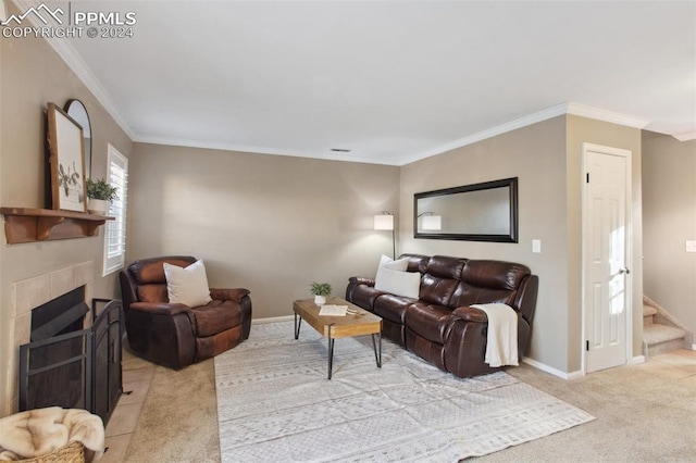 carpeted living room featuring a tiled fireplace and crown molding