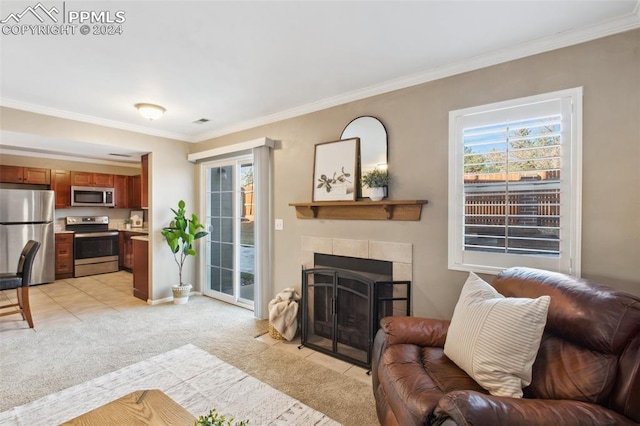 living room featuring light carpet, a fireplace, and crown molding