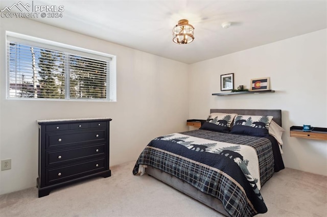 bedroom with light colored carpet