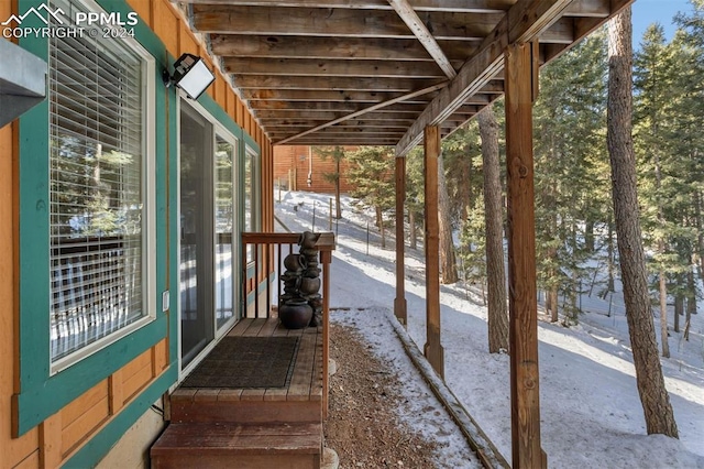 view of snow covered patio