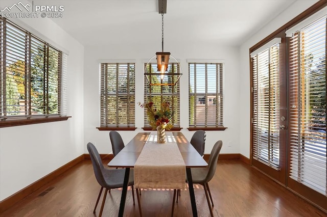 2933 Cathedral Park Vw, Colorado Springs, CO 80904 - dining space featuring plenty of natural light, wood finished floors, and baseboards