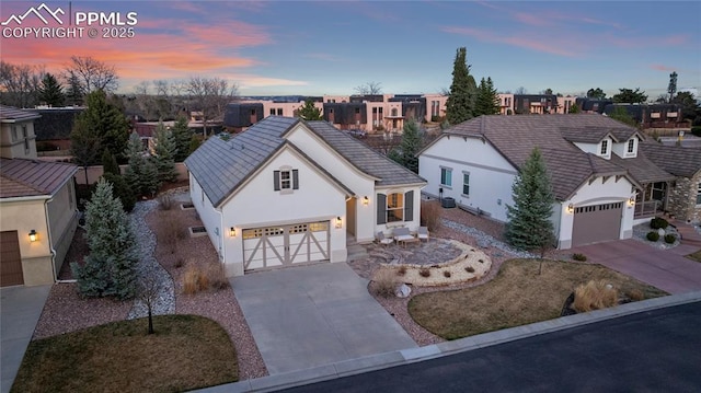 2933 Cathedral Park Vw, Colorado Springs, CO 80904 - view of front of property with concrete driveway, a residential view, stucco siding, and an attached garage