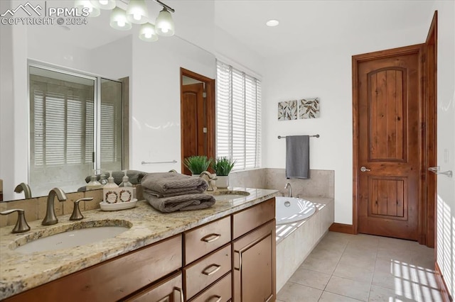2933 Cathedral Park Vw, Colorado Springs, CO 80904 - bathroom featuring a garden tub, tile patterned flooring, a stall shower, and double vanity