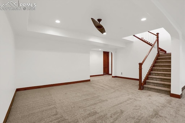 2933 Cathedral Park Vw, Colorado Springs, CO 80904 - below grade area with light carpet, recessed lighting, baseboards, and stairs