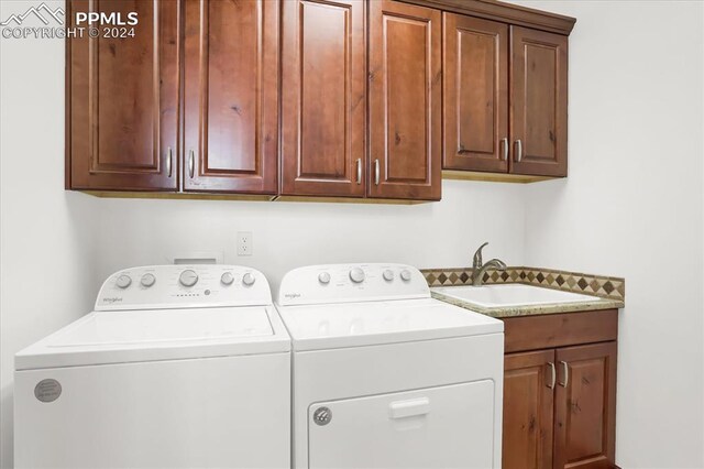 2933 Cathedral Park Vw, Colorado Springs, CO 80904 - laundry area featuring cabinet space and independent washer and dryer