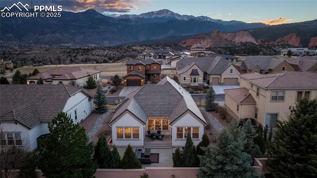 2933 Cathedral Park Vw, Colorado Springs, CO 80904 - aerial view at dusk of a residential view and a mountain view