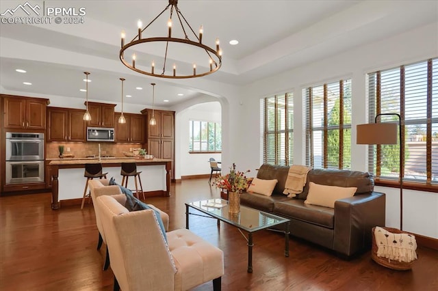 2933 Cathedral Park Vw, Colorado Springs, CO 80904 - living area featuring arched walkways, baseboards, dark wood-type flooring, and recessed lighting