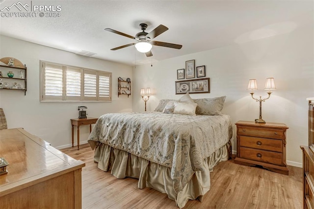 bedroom featuring ceiling fan and light wood-type flooring