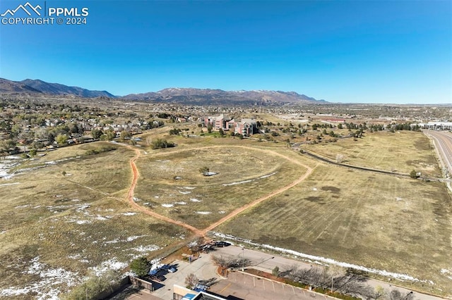 birds eye view of property with a mountain view