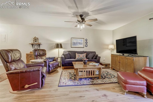 living room with ceiling fan and light hardwood / wood-style floors