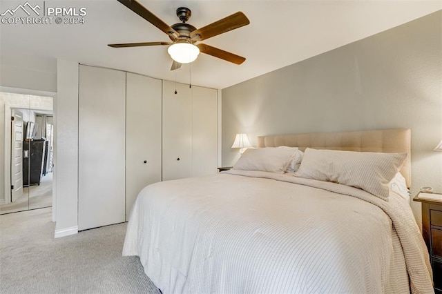 carpeted bedroom with ceiling fan