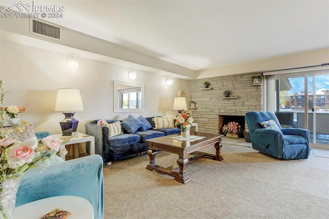 living room with light carpet and a fireplace