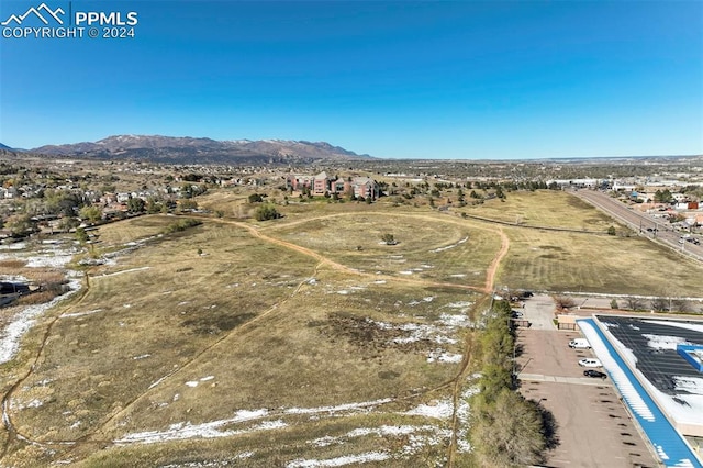 birds eye view of property with a mountain view