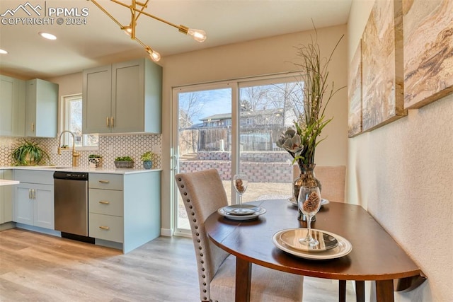 dining room featuring light hardwood / wood-style flooring and sink