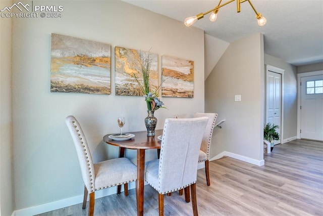 dining space featuring wood-type flooring