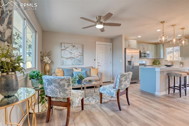 interior space with light wood-type flooring and ceiling fan