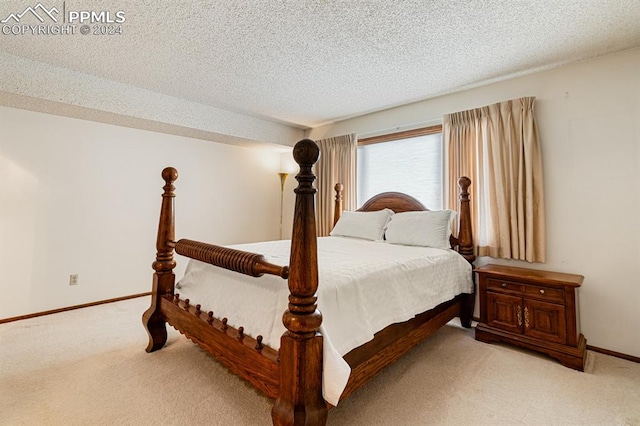 carpeted bedroom with a textured ceiling