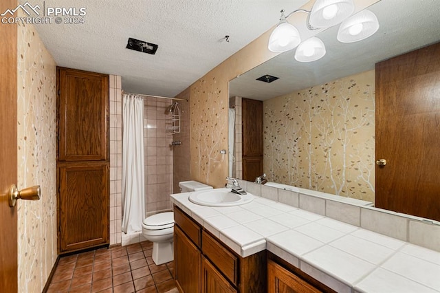 bathroom featuring tile patterned flooring, a textured ceiling, toilet, and walk in shower