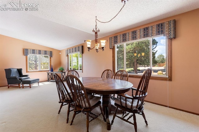 carpeted dining area with a textured ceiling, vaulted ceiling, and an inviting chandelier