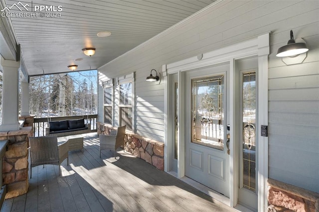 wooden terrace featuring a porch