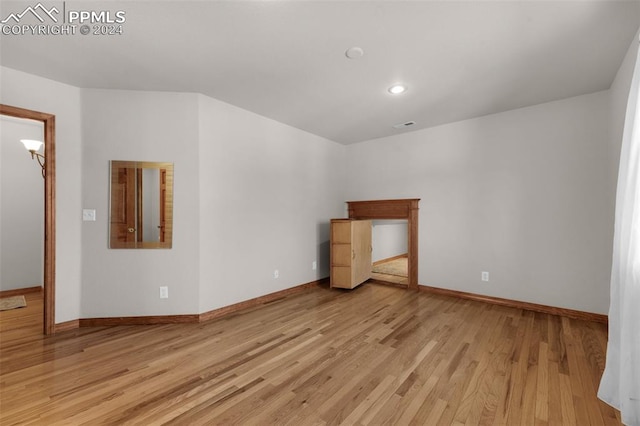 empty room with light hardwood / wood-style floors