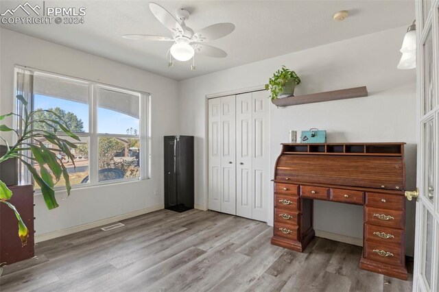 office area with ceiling fan and light hardwood / wood-style flooring