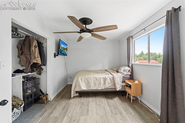 bedroom featuring ceiling fan and light wood-type flooring