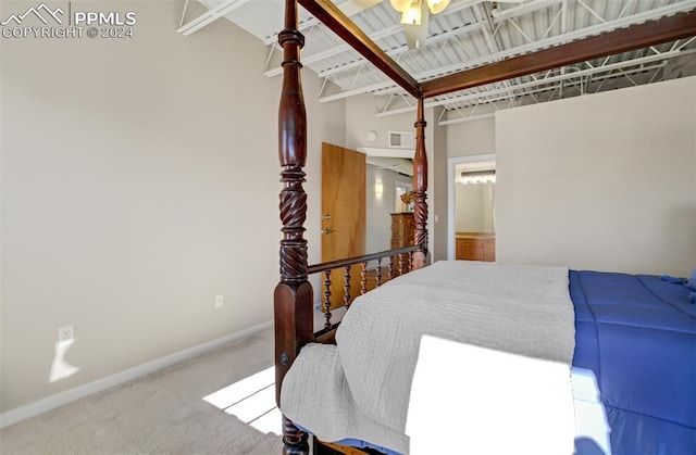 bedroom featuring beam ceiling, ceiling fan, and carpet