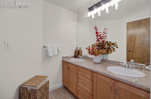 bathroom with tile patterned flooring and vanity