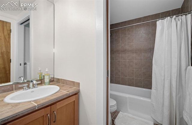 full bathroom featuring vanity, toilet, and shower / tub combo with curtain