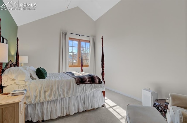 carpeted bedroom featuring vaulted ceiling