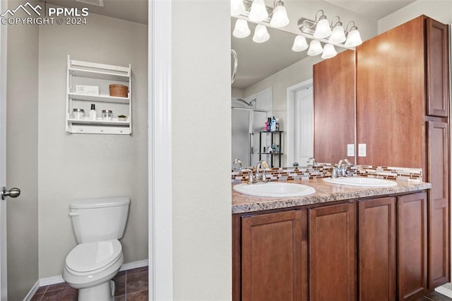 bathroom with tile patterned floors, vanity, and toilet