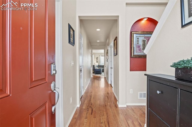 corridor featuring light hardwood / wood-style floors