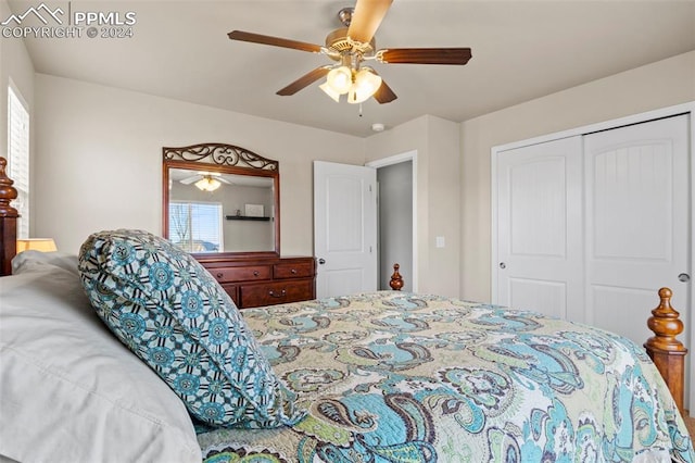 bedroom with ceiling fan and a closet