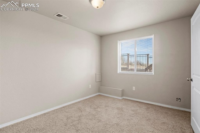 empty room featuring light colored carpet