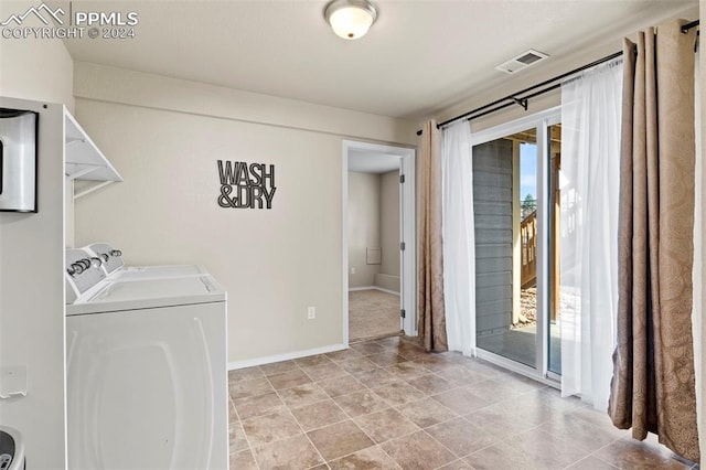 clothes washing area featuring washing machine and dryer